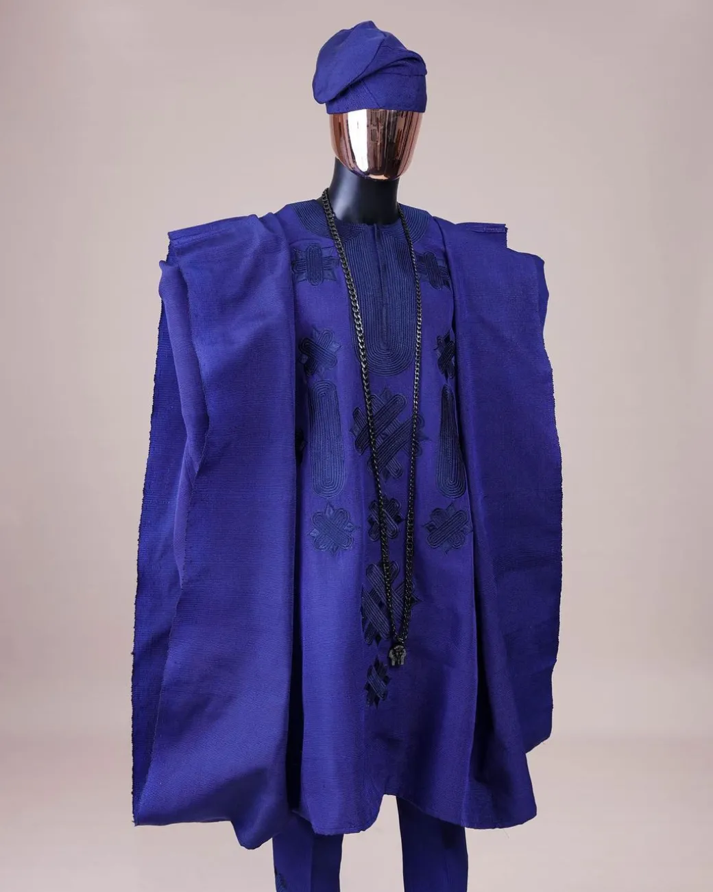 A Navy blue aso-oke, spiral embroidery detailing agbada