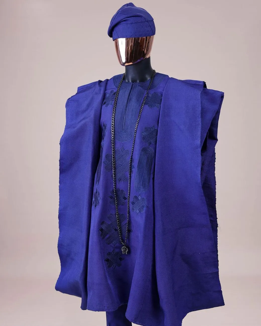 A Navy blue aso-oke, spiral embroidery detailing agbada