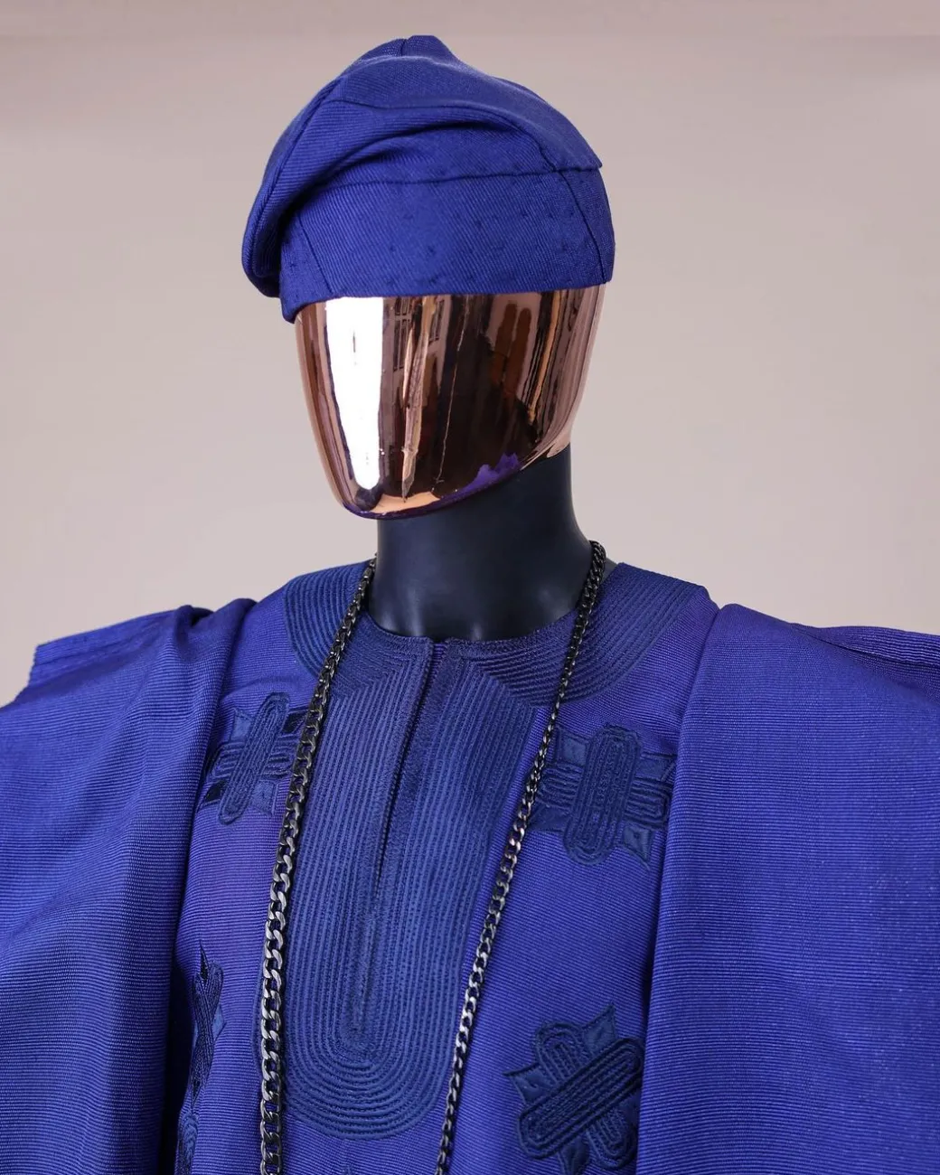 A Navy blue aso-oke, spiral embroidery detailing agbada
