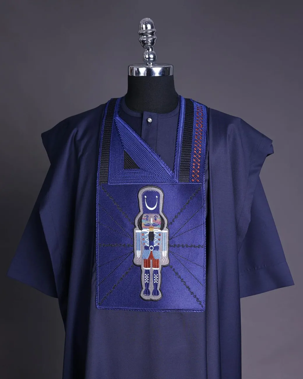 A Navy blue, central head of pagoda embroidery details agbada