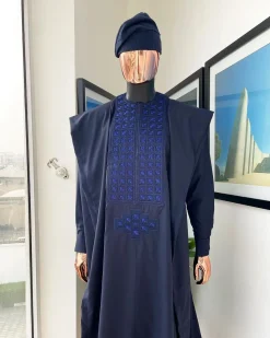 A Navy blue, connected square embroidery design with matching Skye blue Swarovski stone details agbada