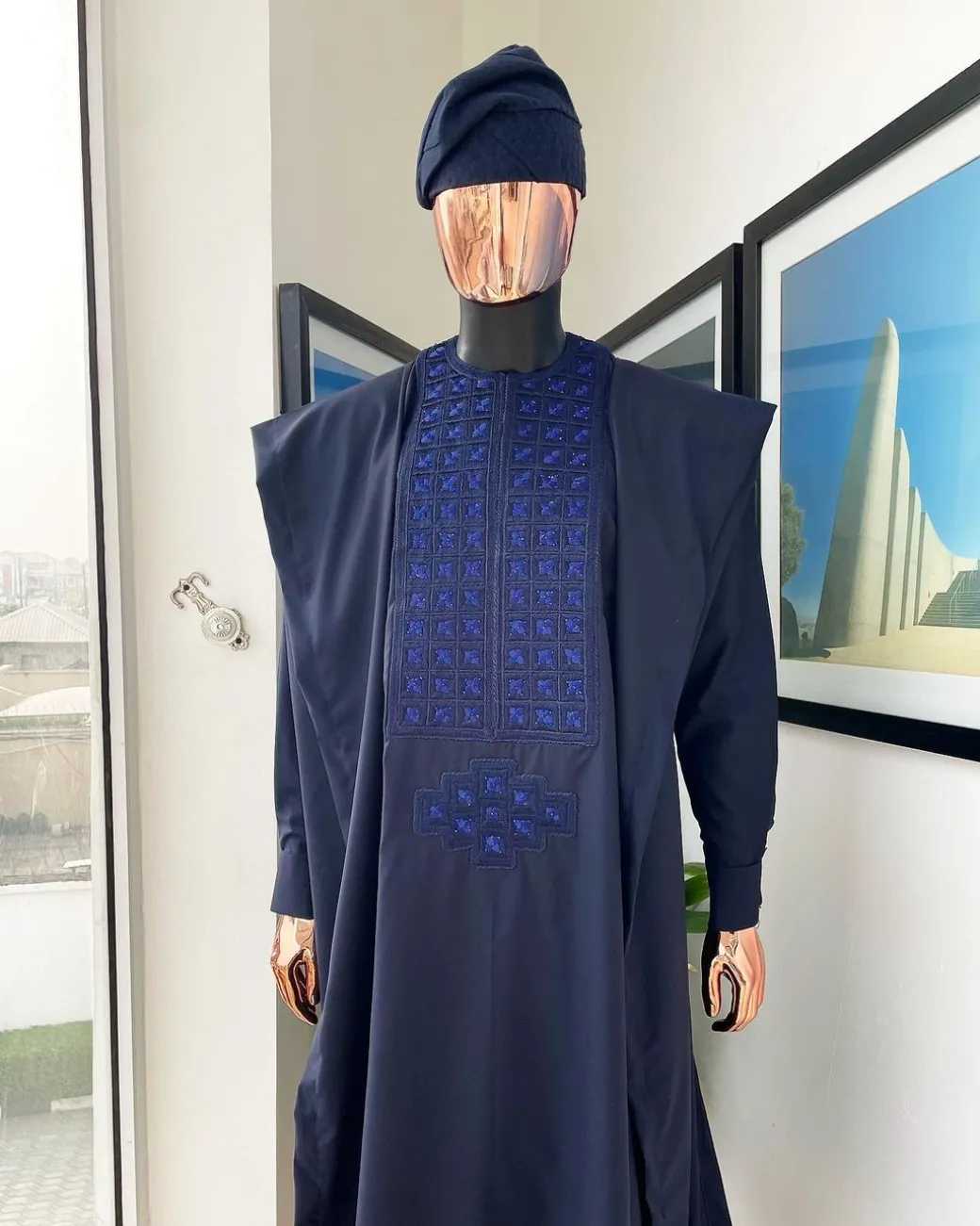 A Navy blue, connected square embroidery design with matching Skye blue Swarovski stone details agbada