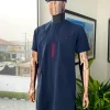 A Navy blue, curly connected with wine paisley detailing african traditional senator kaftan native.