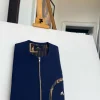 A Navy blue, curved rainbow pocket, gold zip line detailing African traditional senator kaftan