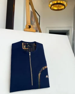 A Navy blue, curved rainbow pocket, gold zip line detailing African traditional senator kaftan