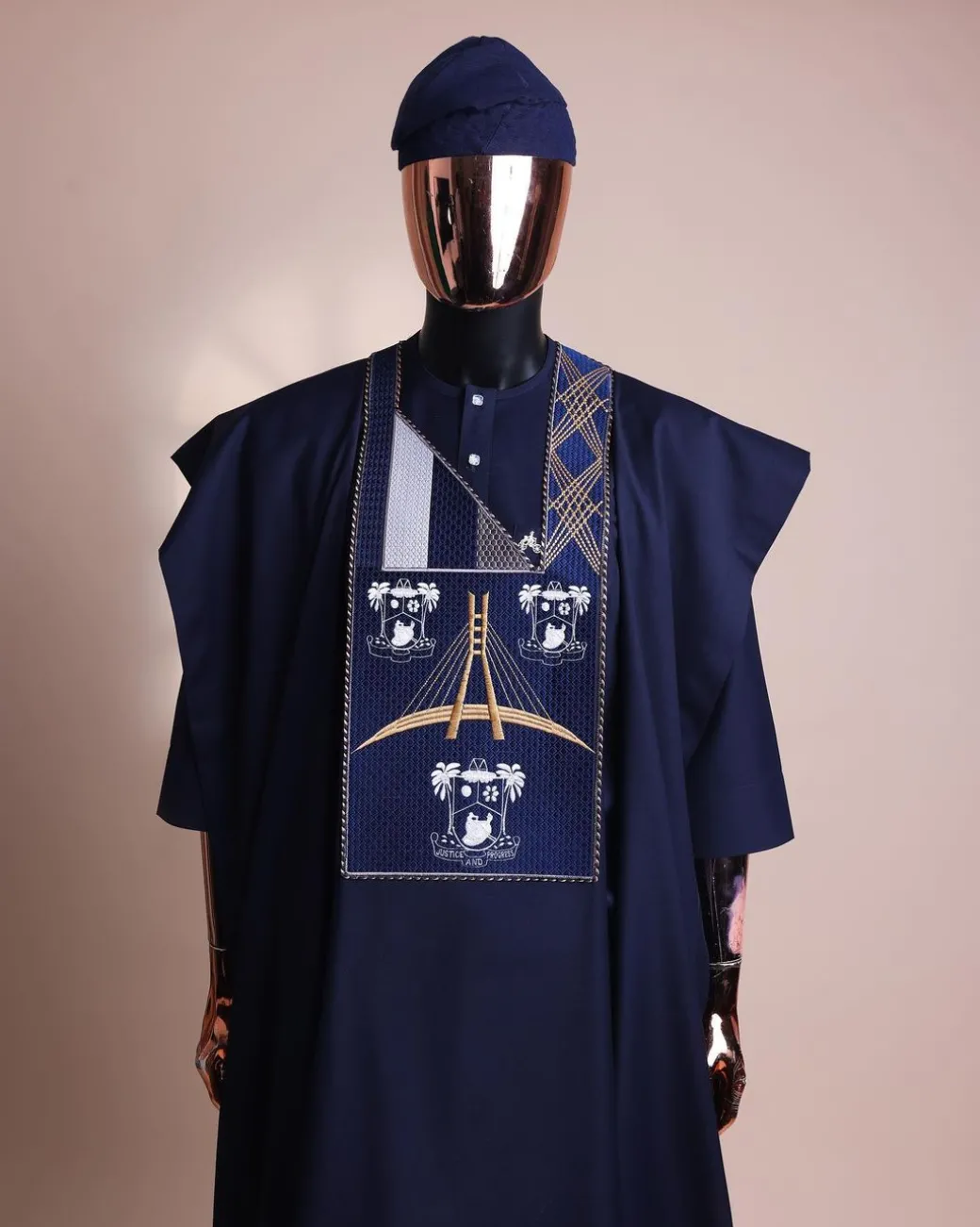 A Navy blue, “Eko Baje Ti – Lagos Will Never Spoil” embroidery details Agbada.