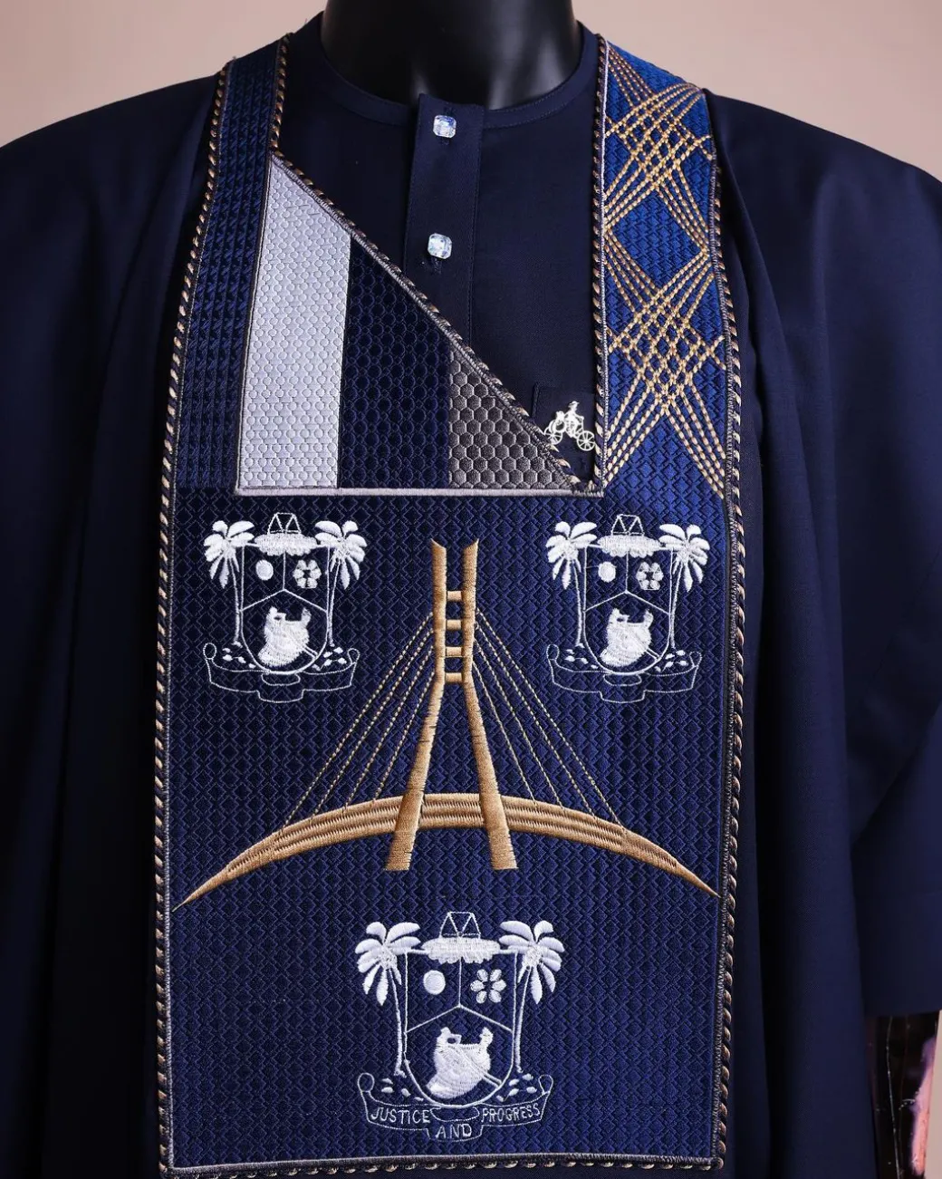 A Navy blue, “Eko Baje Ti – Lagos Will Never Spoil” embroidery details Agbada.