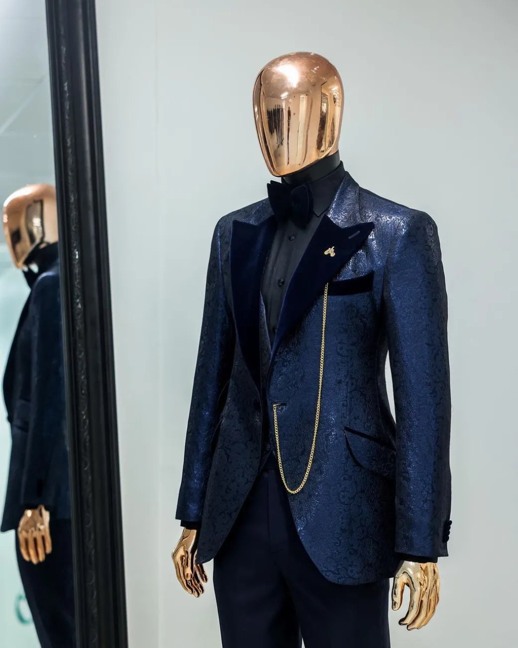 A Navy blue, floral pattern jacquard, peak lapel tuxedo suit