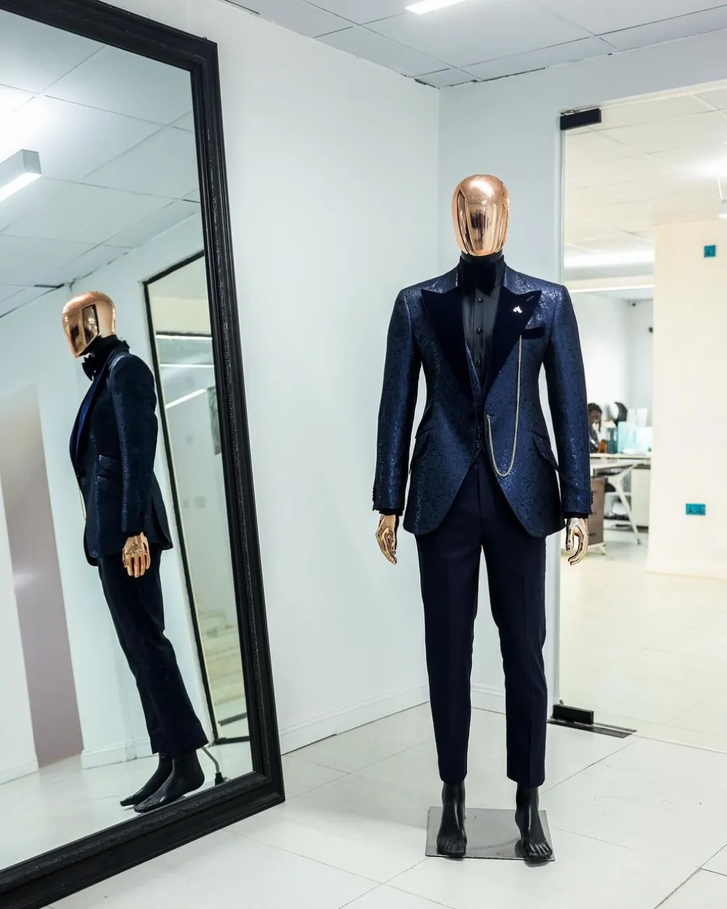 A Navy blue, floral pattern jacquard, peak lapel tuxedo suit