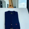 A Navy blue front flap and red lane pocket detail Senator Kaftan native
