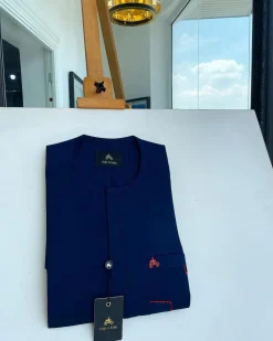 A Navy blue front flap and red lane pocket detail Senator Kaftan native