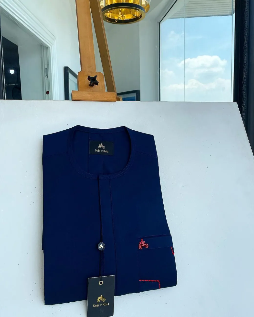 A Navy blue front flap and red lane pocket detail Senator Kaftan native
