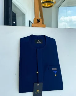 A Navy blue, front flap and slant pocket with inverted tree detailing senator kaftan native.