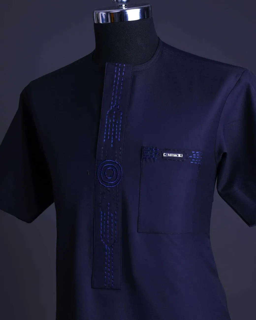 A Navy blue front flap, patch pocket with spiral embroidery detailing African senator Kaftan