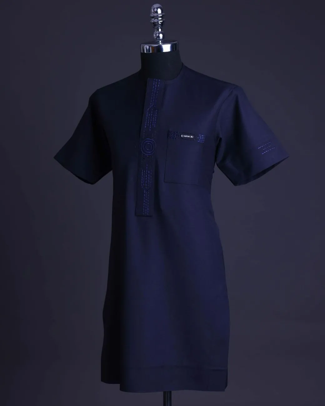 A Navy blue front flap, patch pocket with spiral embroidery detailing African senator Kaftan