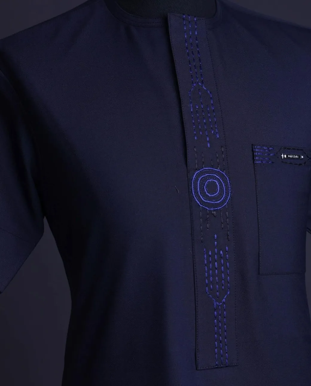 A Navy blue front flap, patch pocket with spiral embroidery detailing African senator Kaftan