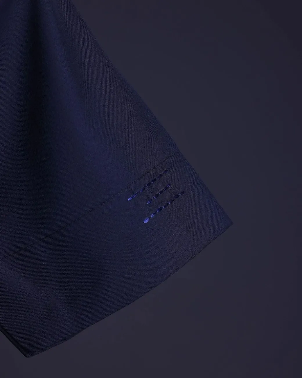 A Navy blue front flap, patch pocket with spiral embroidery detailing African senator Kaftan