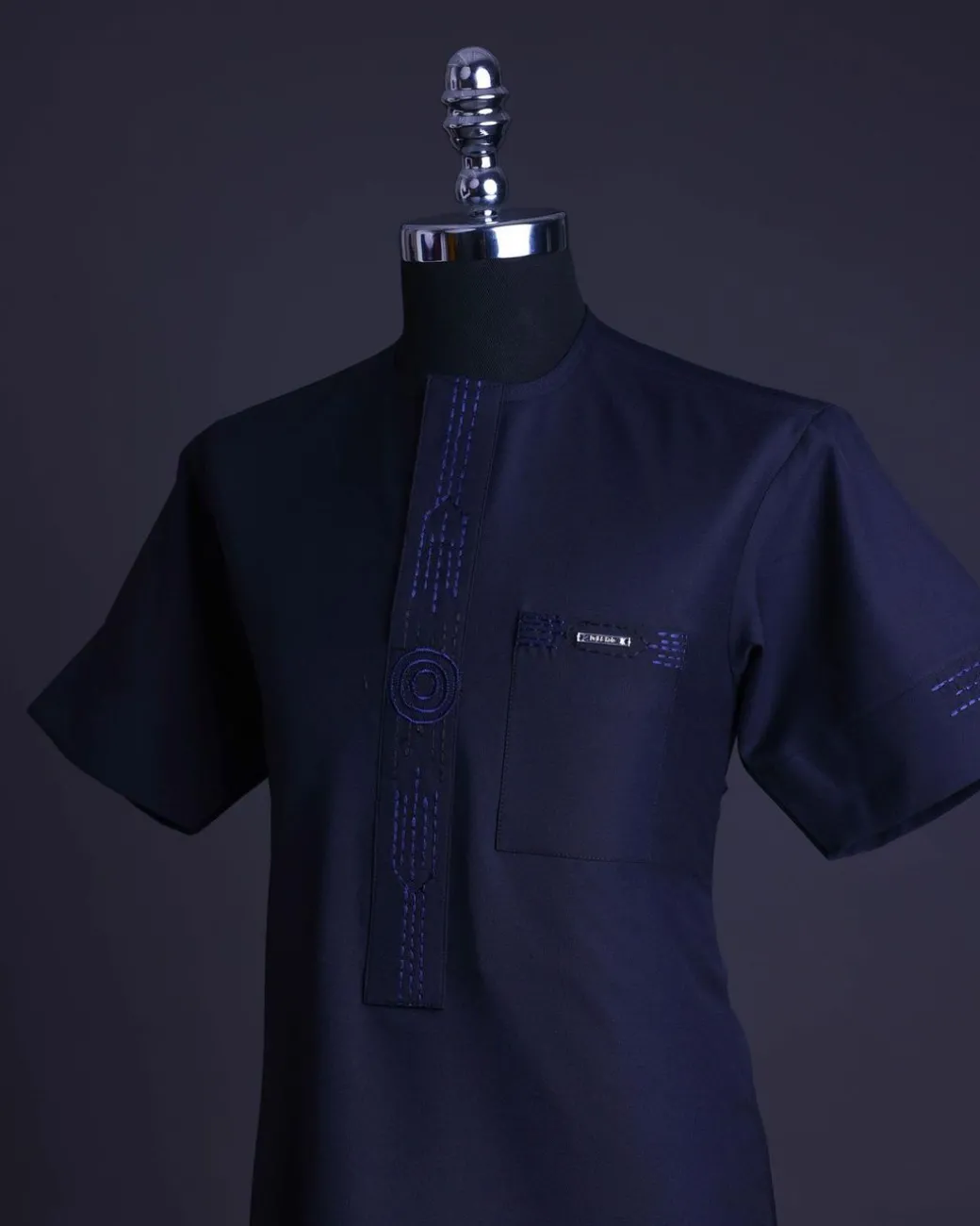 A Navy blue front flap, patch pocket with spiral embroidery detailing African senator Kaftan