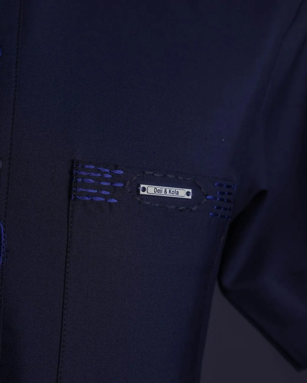 A Navy blue front flap, patch pocket with spiral embroidery detailing African senator Kaftan