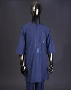 A Navy blue front flap with a clear view Swarovski button, connected sailor and basket embroidery detailing kaftan and Sokoto
