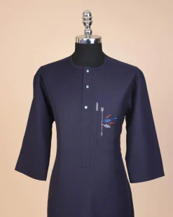 A navy blue, front flap with crystal blue Swarovski button, arrow and floral embroidery 3/4 sleeve African senator kaftan native.