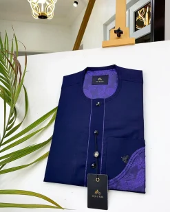 A Navy blue front flap with a clear view of the Swarovski and purple paisley African kaftan
