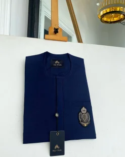 A Navy blue front flap with an Indian hand embroidery patch details African traditional senator kaftan native