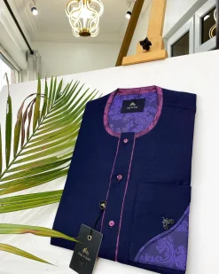 A Navy blue front flap with a clear view of Swarovski crystal buttons, short-sleeve African kaftan
