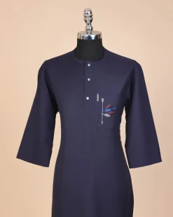A navy blue, front flap with crystal blue Swarovski button, arrow and floral embroidery 3/4 sleeve African senator kaftan native.