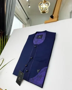 A Navy blue front flap with a clear view of the Swarovski and purple paisley African kaftan