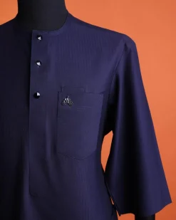 A Navy Blue, invisible pencil stripe, Jorgecarli wool, front flap, layered suit & pen pocket, 3/4 sleeve and clear view silver Swarovski button African senator kaftan native.