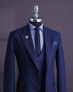 A Navy blue, ivory pencil stripe, jorgecarli, peak lapel suit