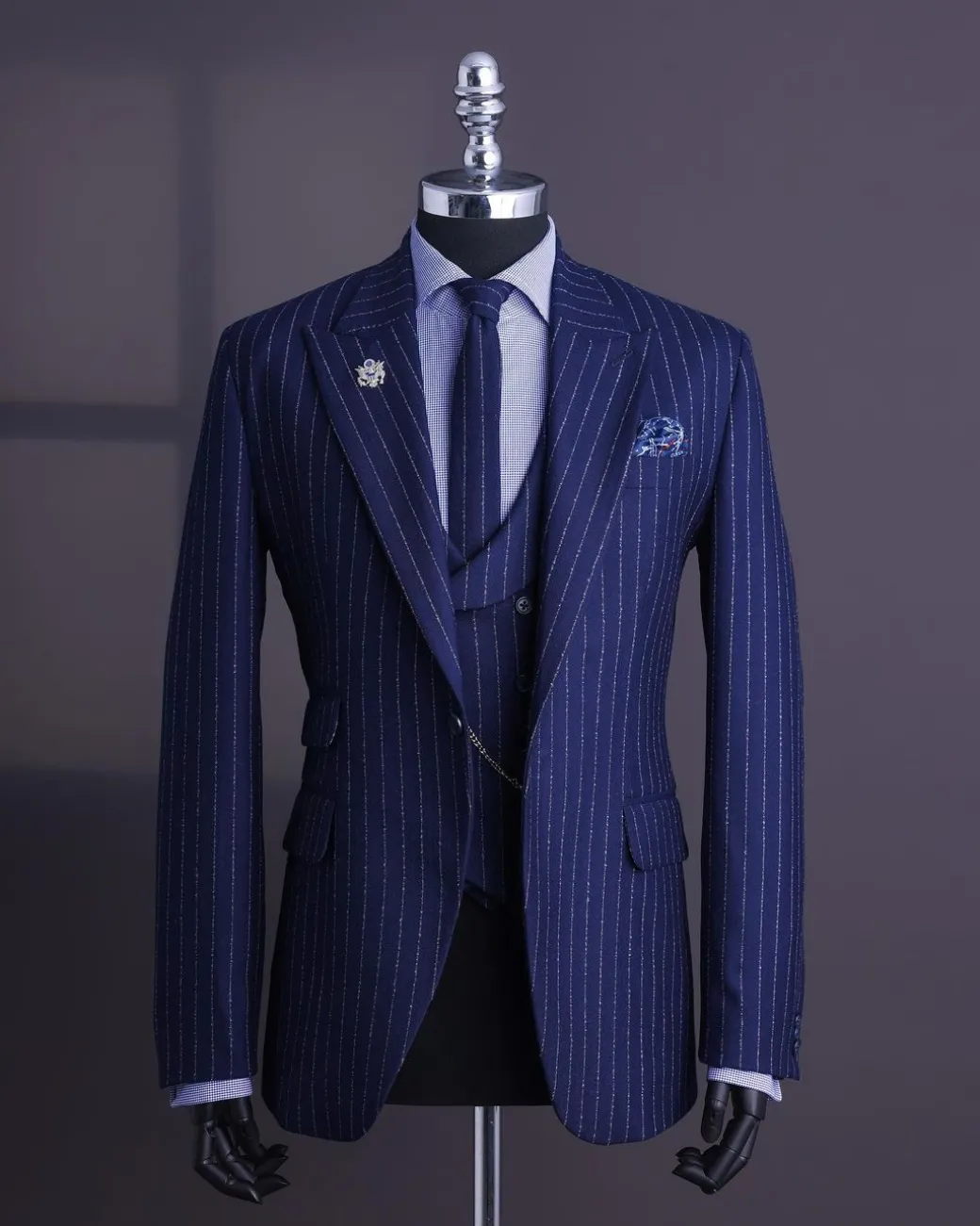 A Navy blue, ivory pencil stripe, jorgecarli, peak lapel suit