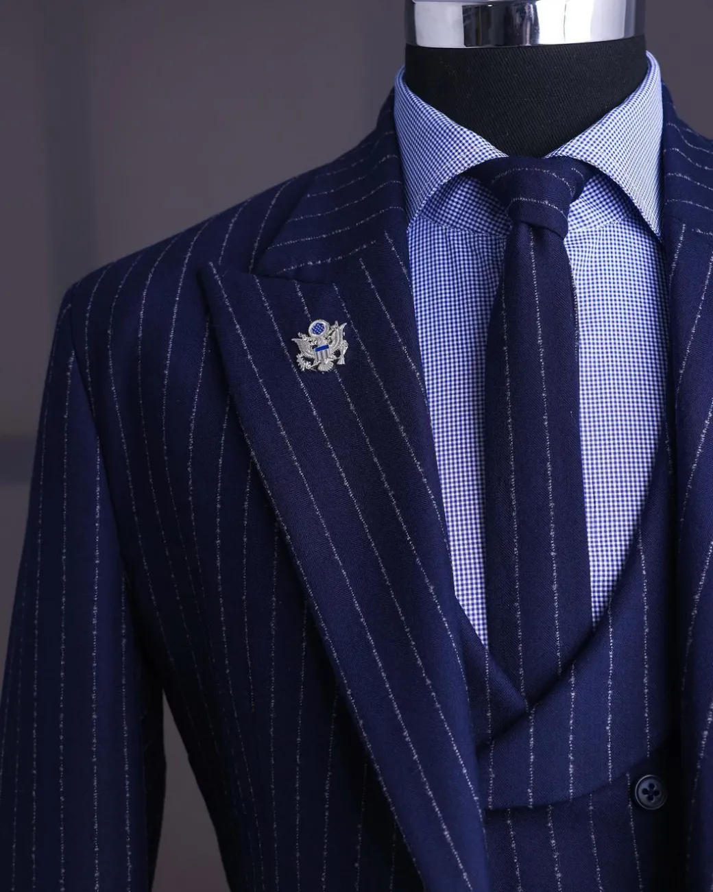 A Navy blue, ivory pencil stripe, jorgecarli, peak lapel suit
