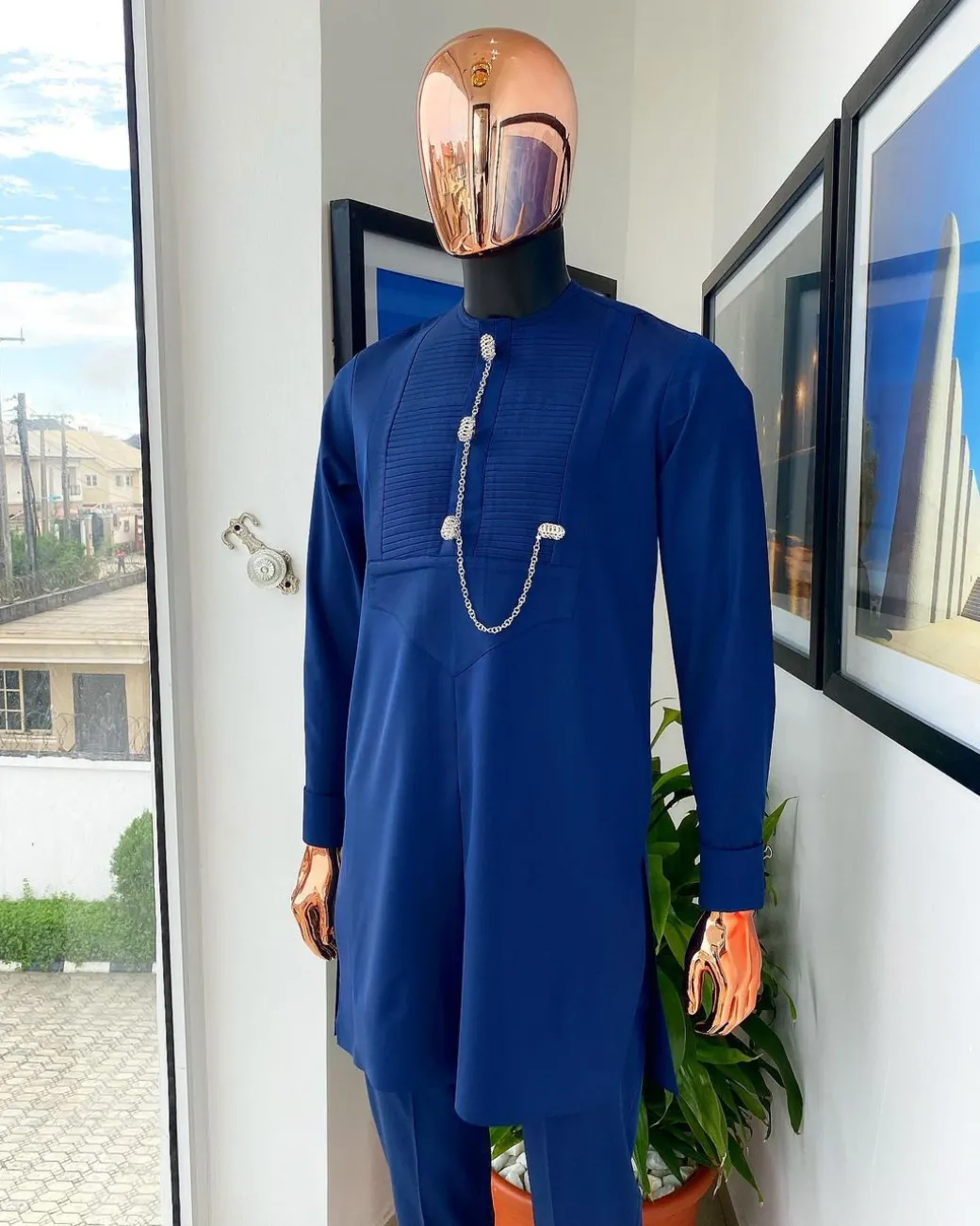 A Navy blue men’s Etibo with sliver accessories detailing.