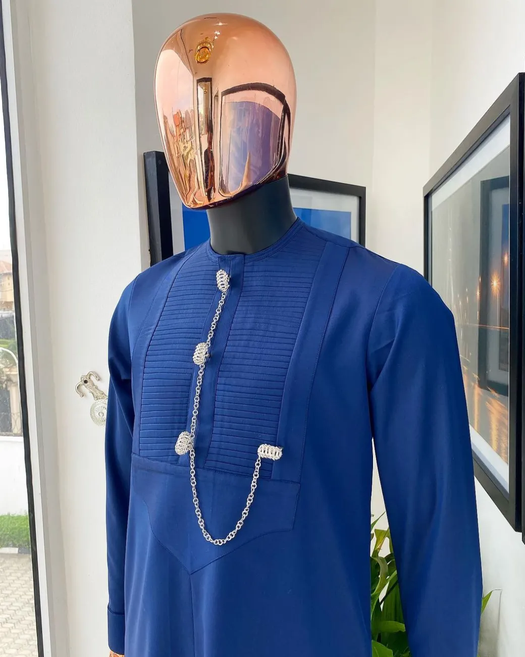 A Navy blue men’s Etibo with sliver accessories detailing.