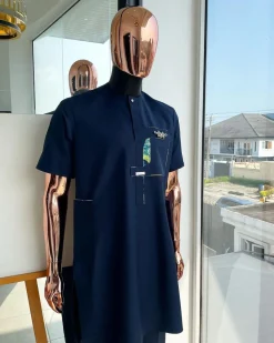 A Navy blue, multileg intersection pocket with clear view flap Swarovski button detailing african traditional senator kaftan native.