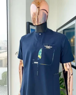 A Navy blue, multileg intersection pocket with clear view flap Swarovski button detailing african traditional senator kaftan native.