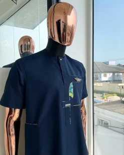 A Navy blue, multileg intersection pocket with clear view flap Swarovski button detailing african traditional senator kaftan native.