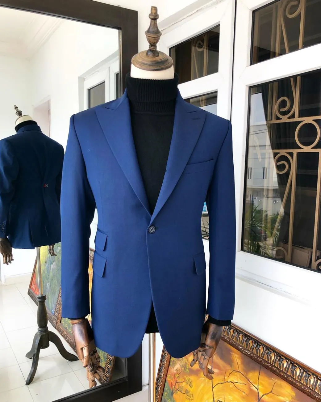 A Navy Blue Peak Lapel Business Suit