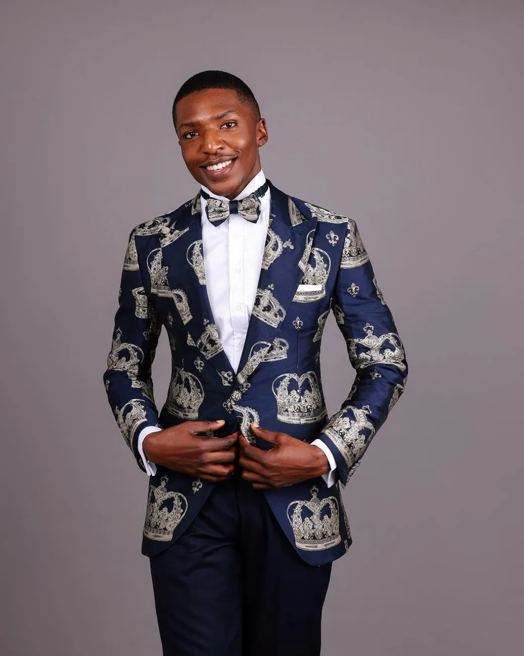 A Navy Blue Peak Lapel, Dispersed Crown Metallic Jacquard Tuxedo Suit And Wide Cut Pant Trouser.