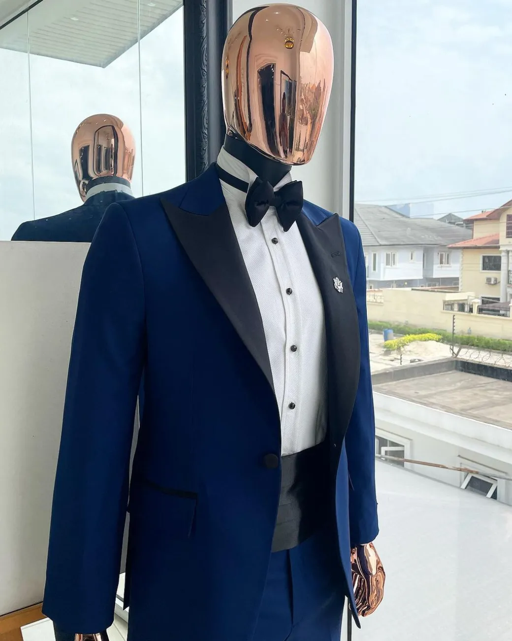 A Navy blue peak lapel tuxedo suit
