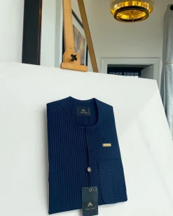 A Navy blue pencil stripe with reverse line pocket, zip line front flap, African kaftan native