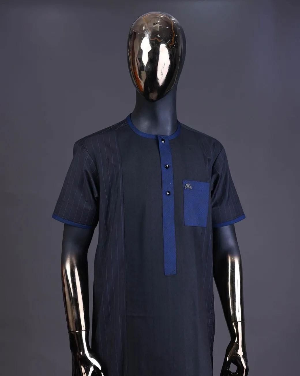 A Navy blue pencil stripe on black, black front with matching blue-black Swarovski button detailing kaftan and Sokoto