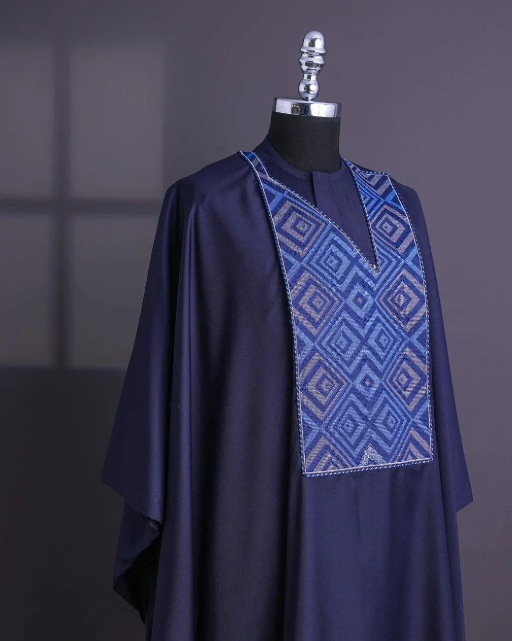 A Navy Blue, perspective square with keke Elemu embroidery details Agbada