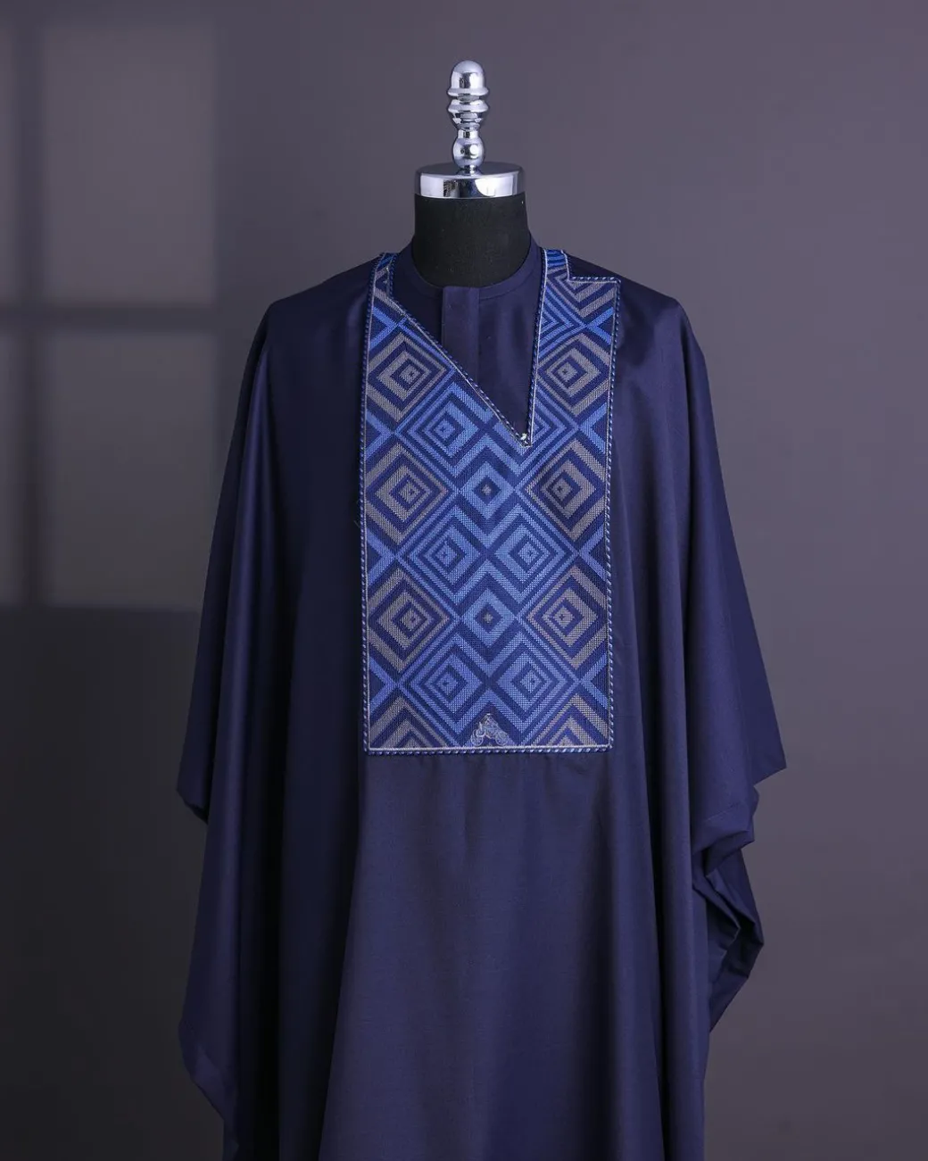 A Navy Blue, perspective square with keke Elemu embroidery details Agbada
