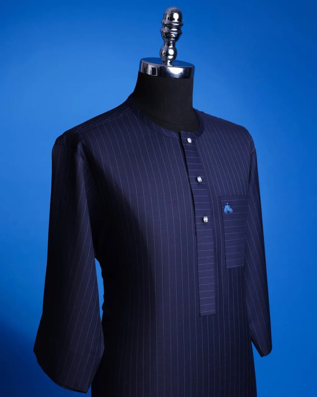 A Navy Blue, Pin Stripe, front flap & Pocket interchanged, 3/4 sleeve African senator kaftan native.