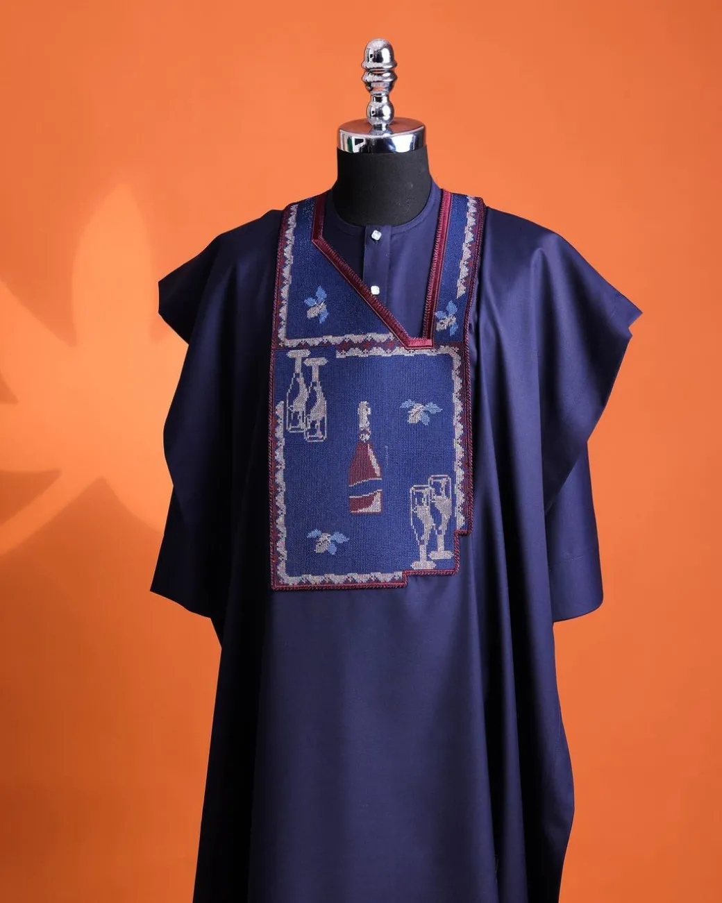 A Navy blue, “pop pop pop”embroidery details agbada, mint blue clear view Swarovski buttons on 3/4 sleeve kaftan & sokoto