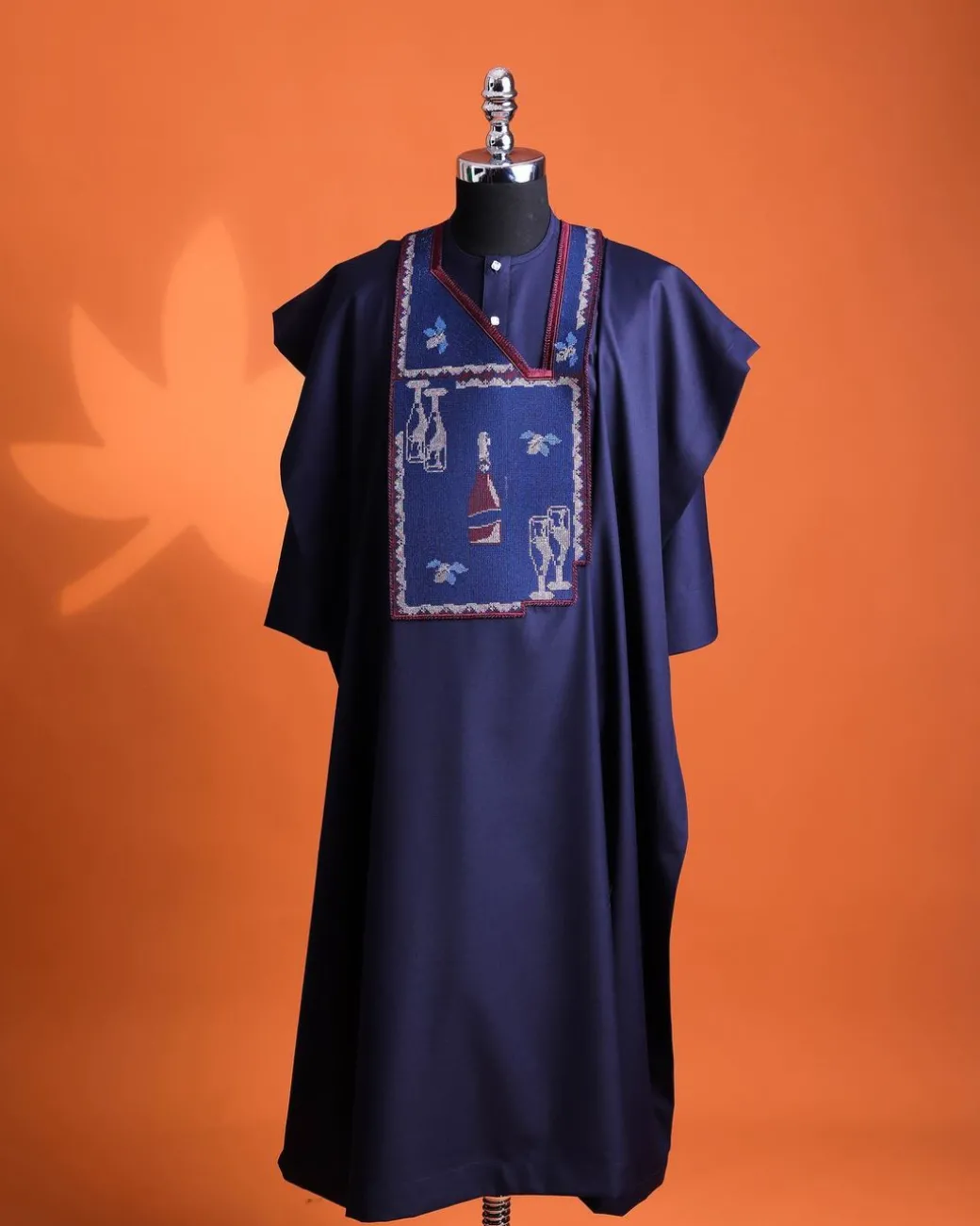 A Navy blue, “pop pop pop”embroidery details agbada, mint blue clear view Swarovski buttons on 3/4 sleeve kaftan & sokoto