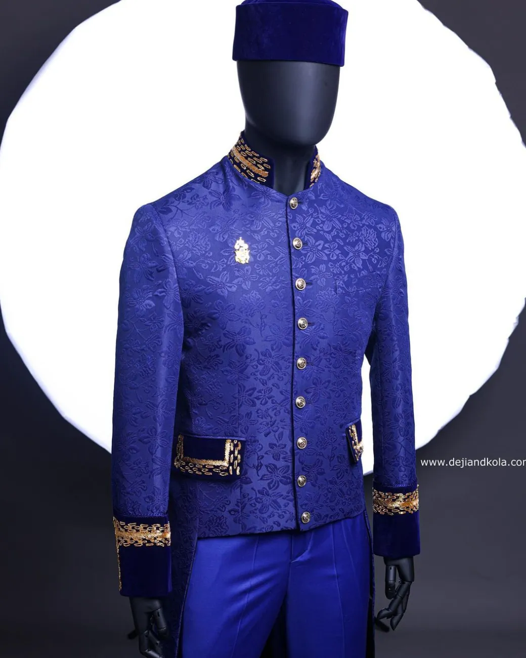 A Navy blue “Prince of Persia” ceremonial tail suit, Gold Metal Wire hand woven embroidery detail mix on velvet